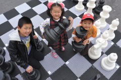 The annual Middlesbrough Mela was held in it's new home of Centre Square in the town centre on Sunday afternoon with a great mix of food, fun, dance and singing.L2R Zhi Peng Guo, Shi Yu Guo and Zhong Ze Guo play on the giant chess board.